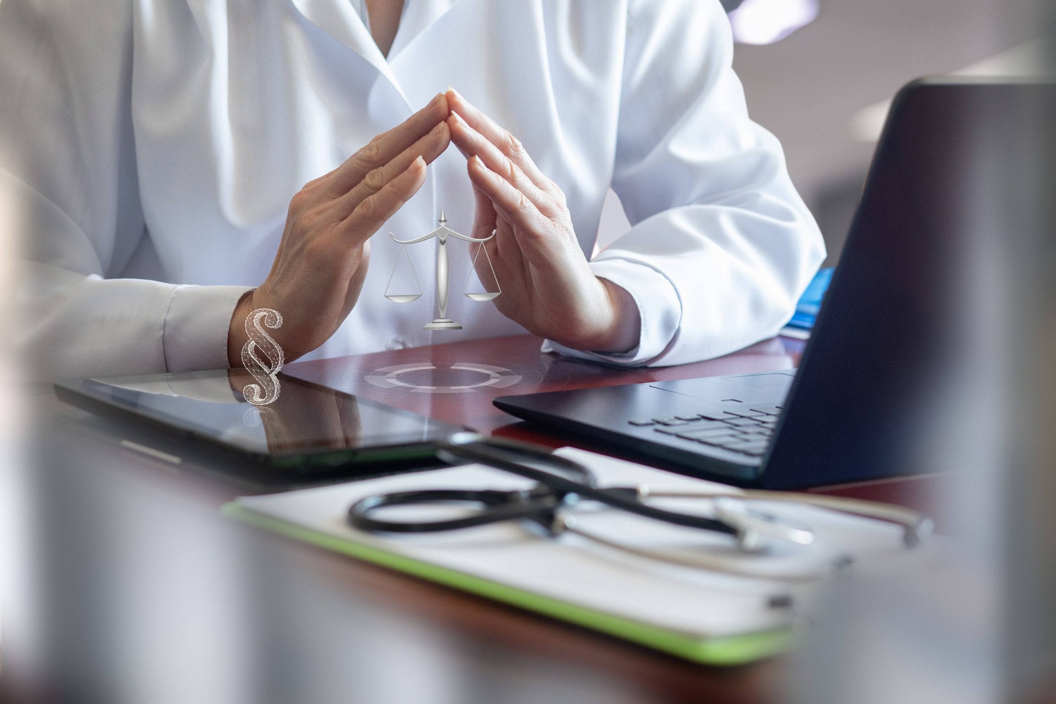 Doctor at desk with digital icons